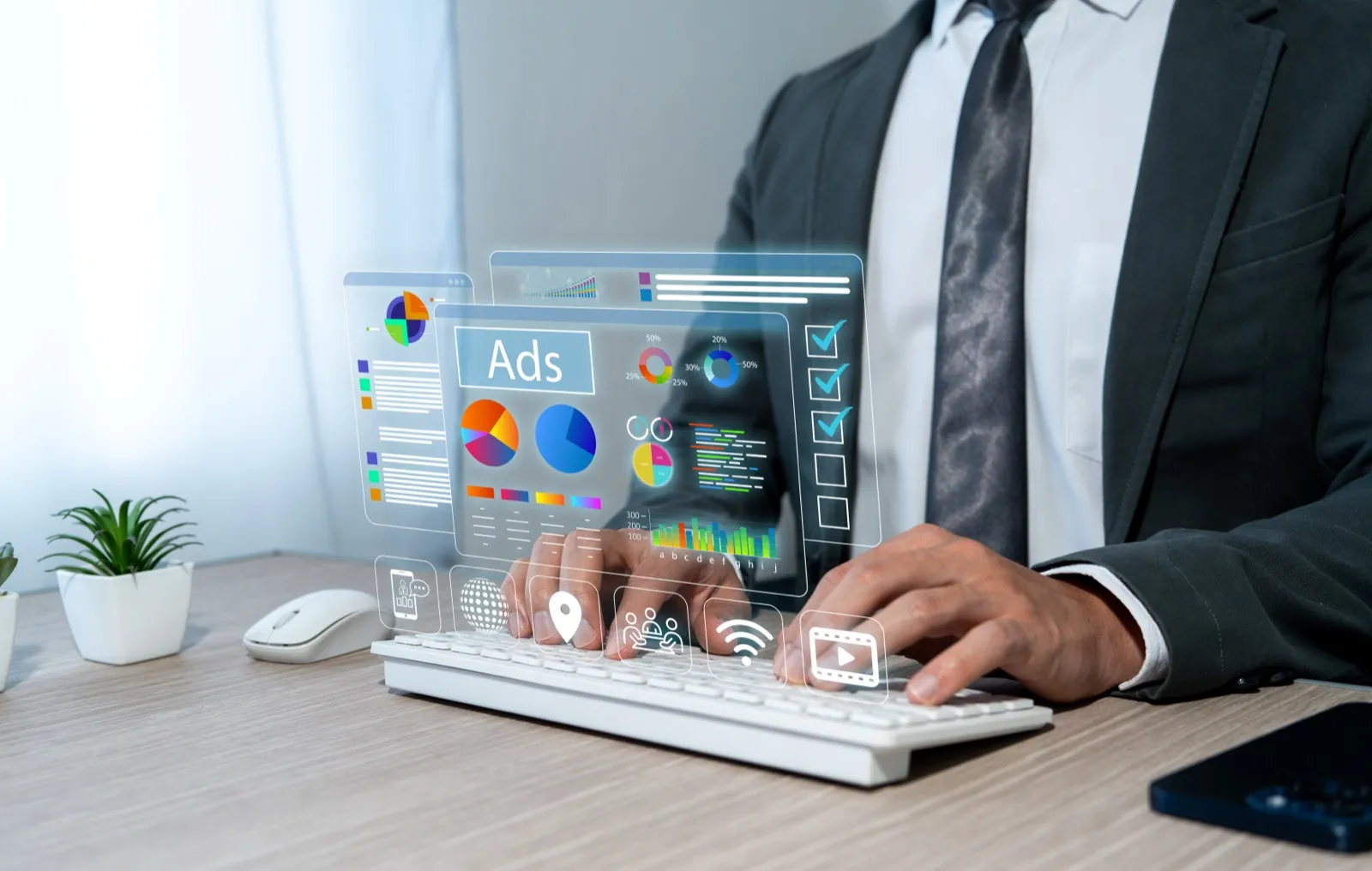Businessman analysing digital advertising data on screen