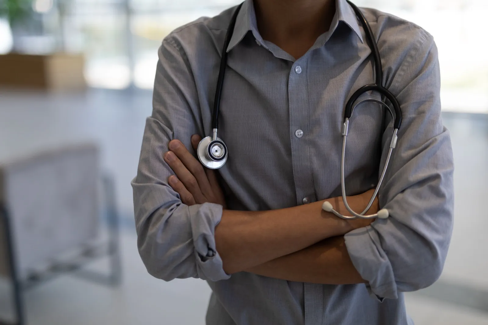 Doctor in a white coat standing with a stethoscope