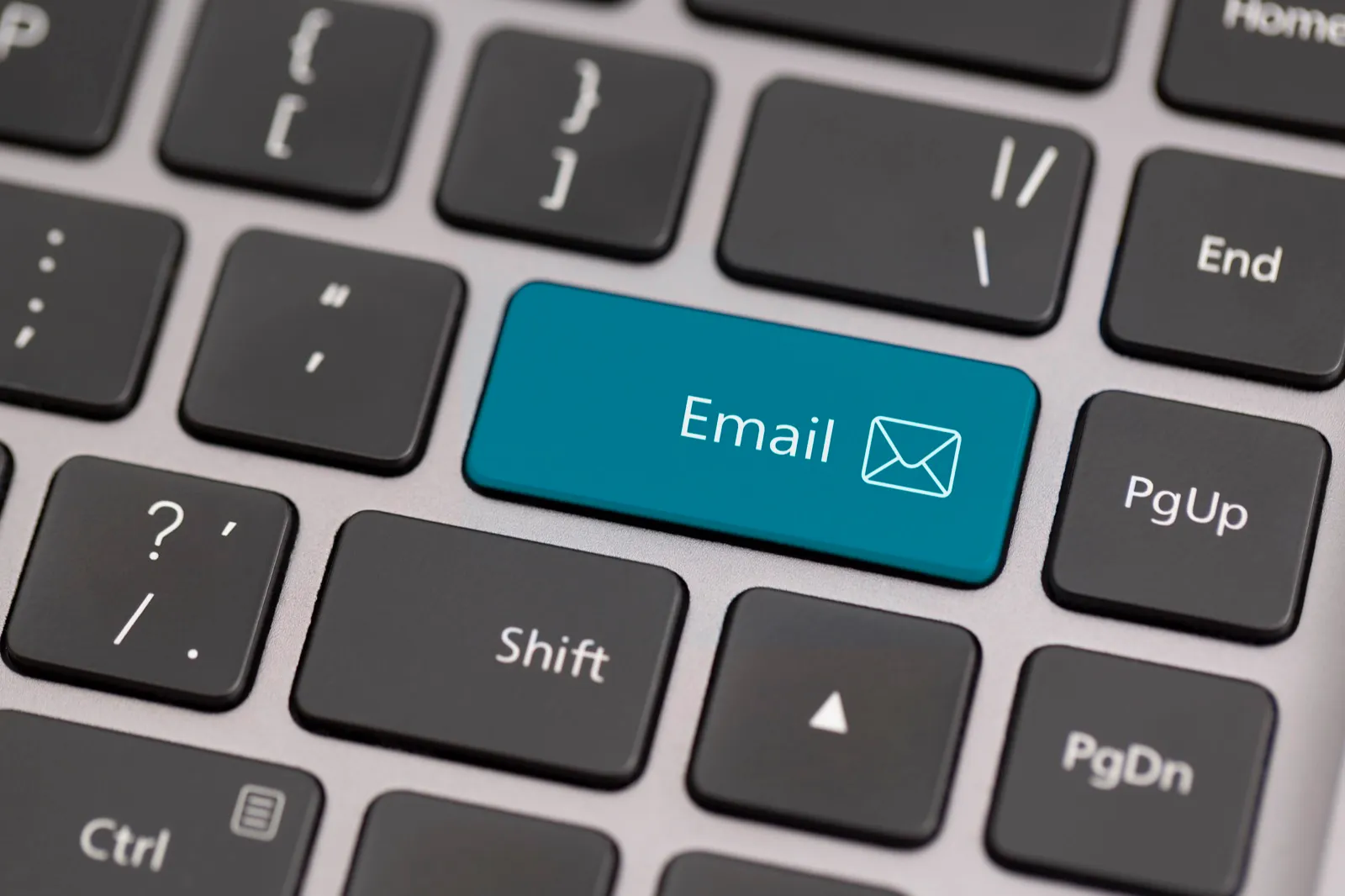 Email key highlighted on a laptop keyboard