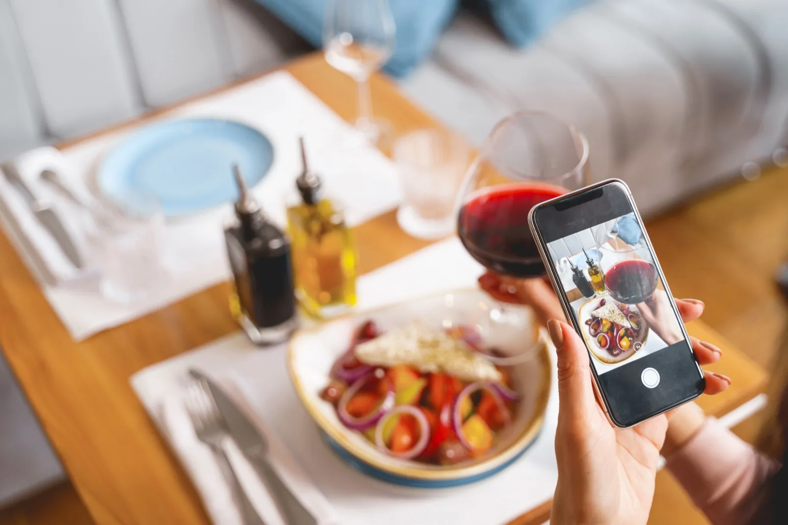 Creator photographing food with a smartphone for social media