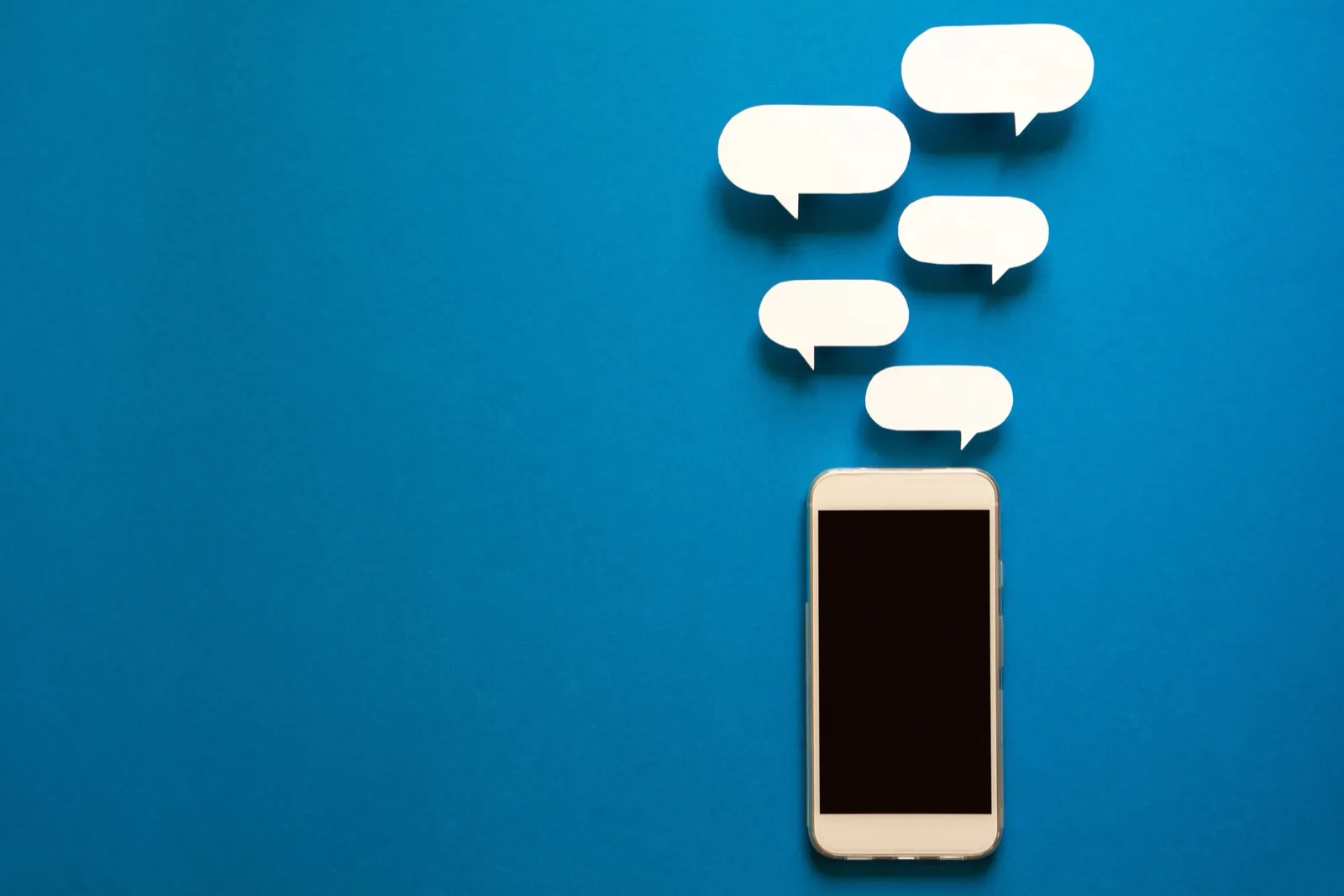 Smartphone with speech bubble notifications